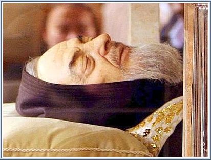 The body of Saint Padre Pio exposed in the crypt in San Giovanni Rotondo where Joshua's father implored the saint to give him new hope