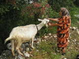 A local woman and a goat