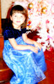 Child in Front of Christmas Tree