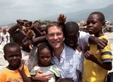 Magnus Macfarlane-Barrow is mobbed by children in Haiti