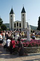 People before statue of Queen Of Peace on Gospa Square