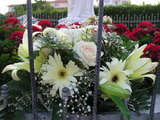 Flowers before Our Lady statue