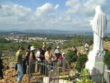 Pilgrims before the statue of Queen of Peace at Podbrdo