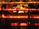 Candles below the Wooden Cross