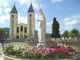 Statue of Queen of Peace and St. James Church